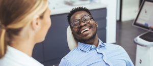 Patient smiling during dental consultation at Fountain City Smiles, emphasizing personalized care and comfort in oral health services.