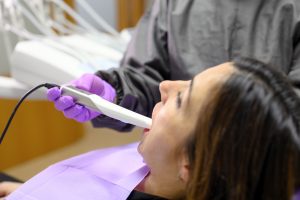 dentist using iTero scanner on patient