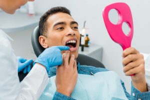 checking smile after having a dental emergency