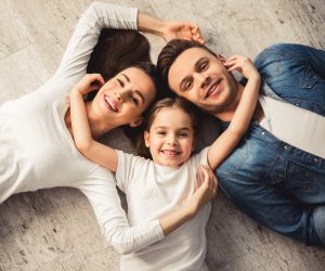 family of three smiling